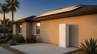 California home with rooftop solar and a Kora Powerblocks home battery tower at the side of the house under an evening sky.